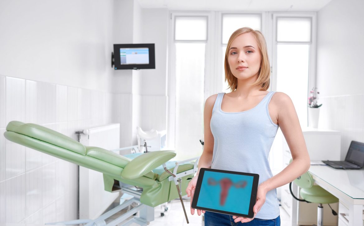 Beautiful young woman visiting doctor
