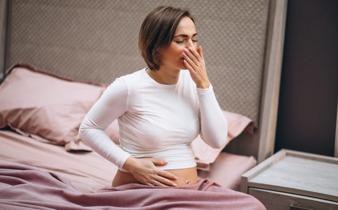 Young pregnant woman having toxicosis in first trimester